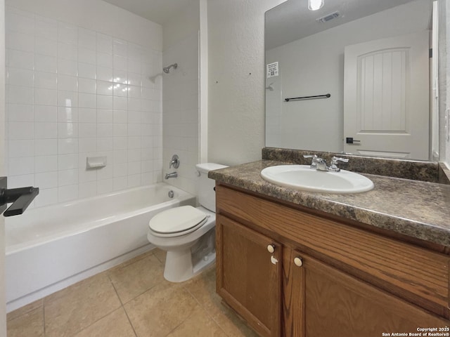 full bathroom with tile patterned floors, vanity, toilet, and tiled shower / bath combo