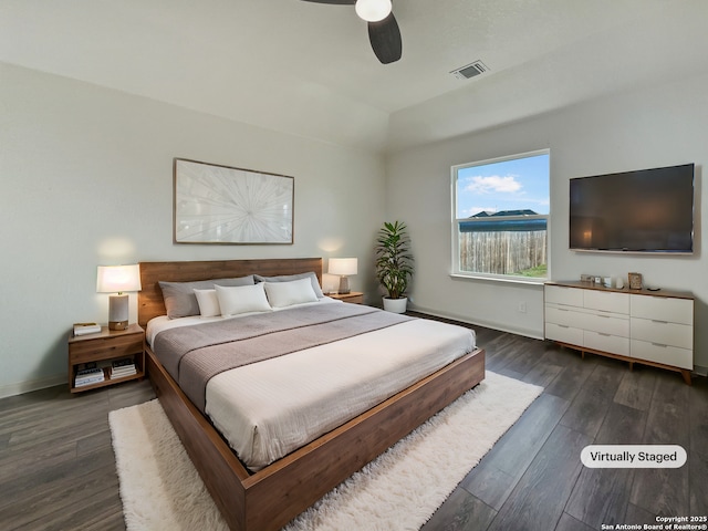 bedroom with ceiling fan and dark wood-type flooring