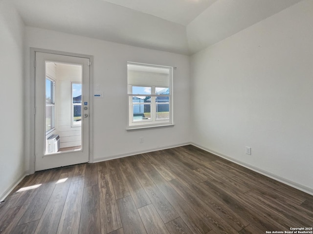 unfurnished room with dark hardwood / wood-style floors