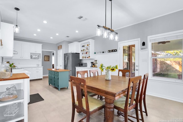 dining room with crown molding