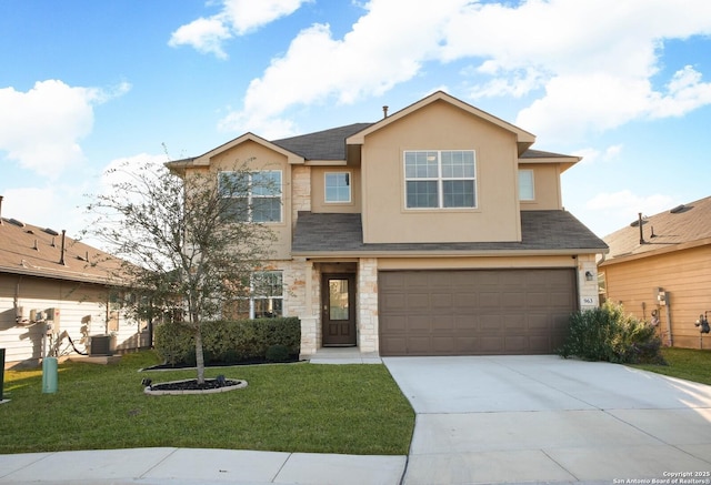 view of front of property with a front yard, central AC, and a garage