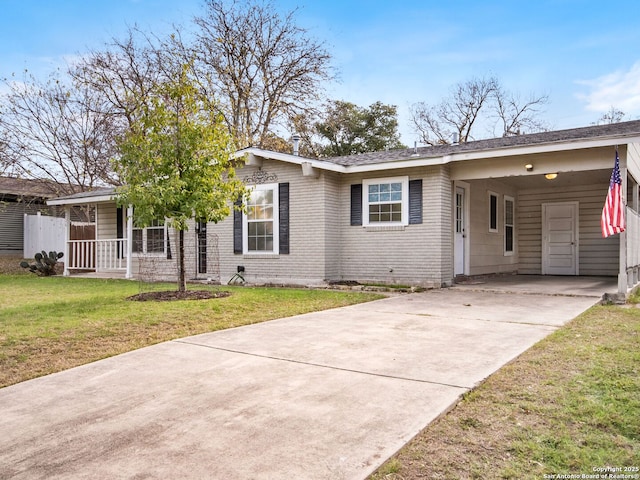 single story home with a carport and a front lawn