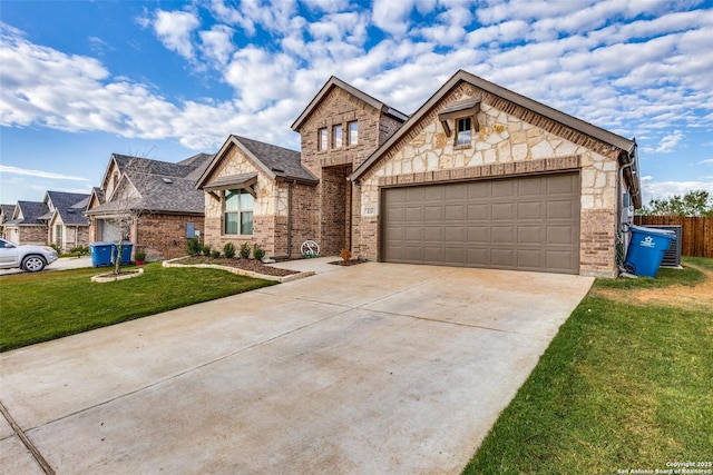 view of front of house featuring a front lawn and a garage