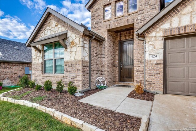 entrance to property featuring a garage