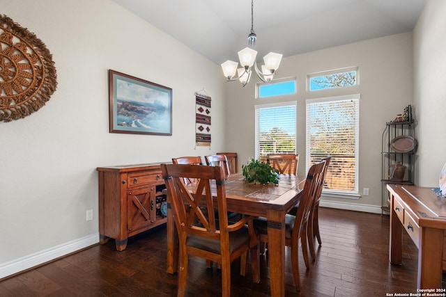 dining space featuring a notable chandelier and dark hardwood / wood-style flooring