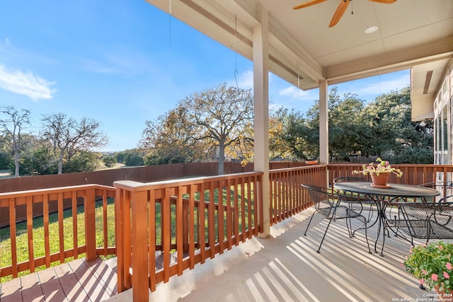 wooden terrace featuring ceiling fan