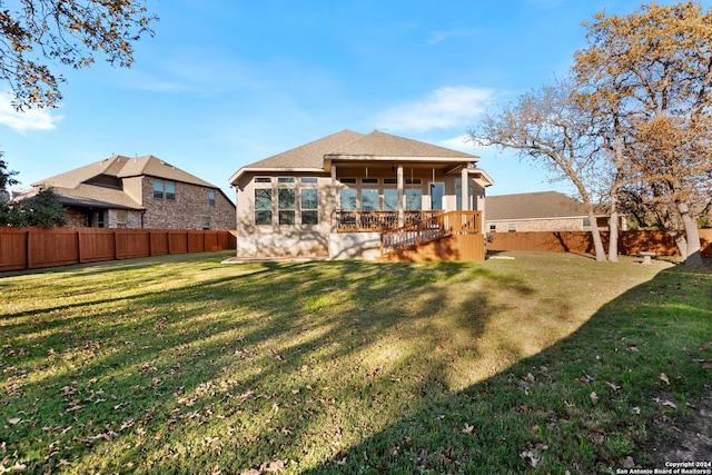 back of property featuring a lawn