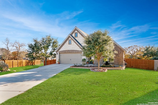 view of front of house with a front yard and a garage