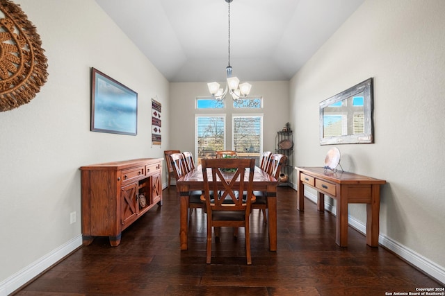 dining space featuring a chandelier, dark hardwood / wood-style flooring, and lofted ceiling