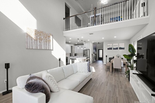 living room with a towering ceiling