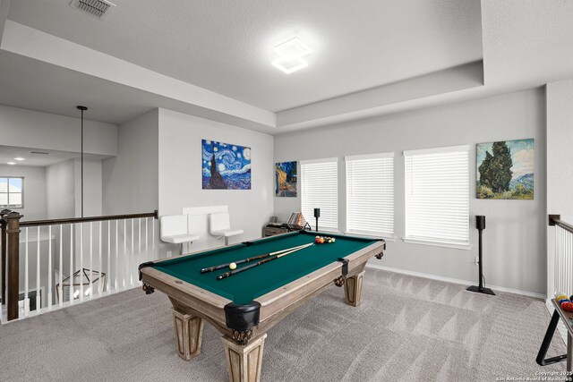 recreation room with a raised ceiling, carpet, a textured ceiling, and pool table