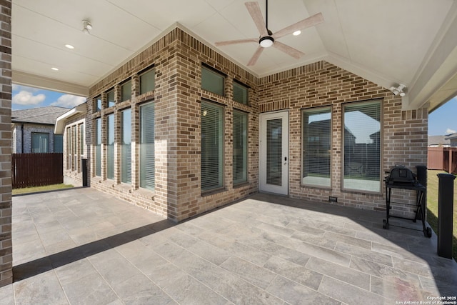 view of patio / terrace with area for grilling and ceiling fan