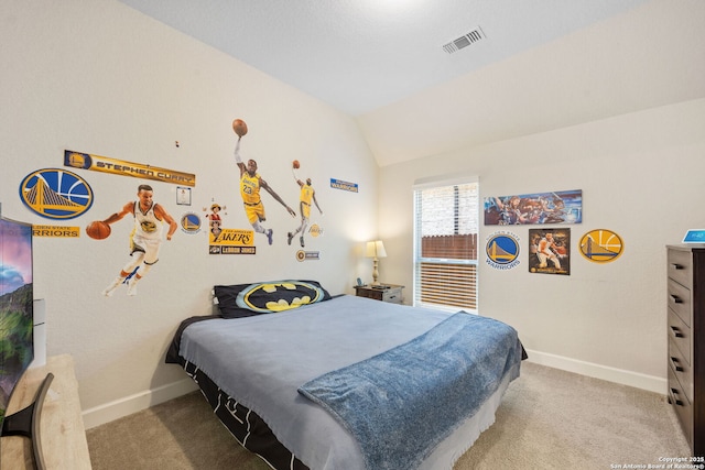 bedroom with light colored carpet and lofted ceiling