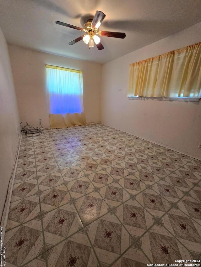 unfurnished room featuring ceiling fan