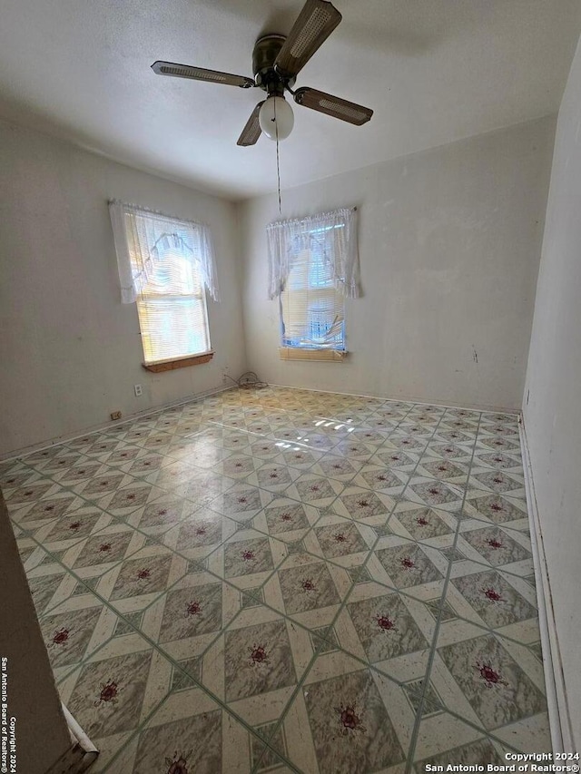 spare room featuring ceiling fan