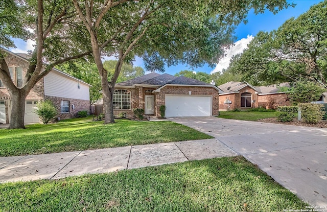 ranch-style home featuring a garage and a front lawn