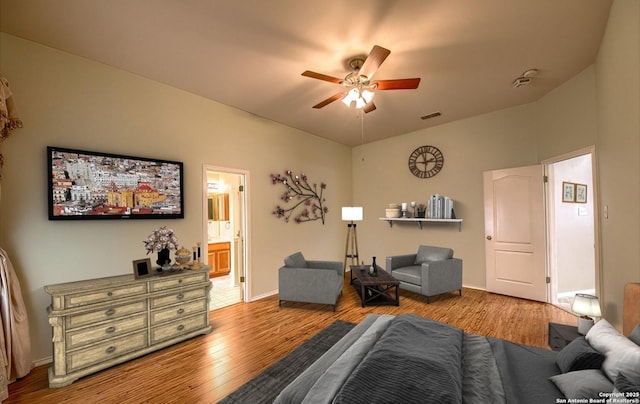 living room with ceiling fan and light hardwood / wood-style floors