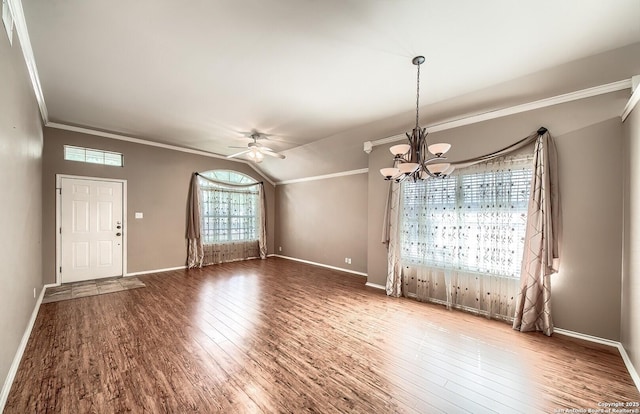 interior space with hardwood / wood-style flooring, ceiling fan with notable chandelier, crown molding, and a wealth of natural light