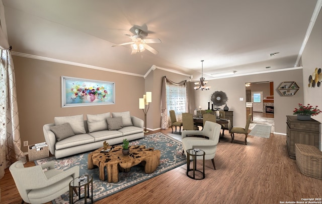 living room with hardwood / wood-style floors, plenty of natural light, and ornamental molding