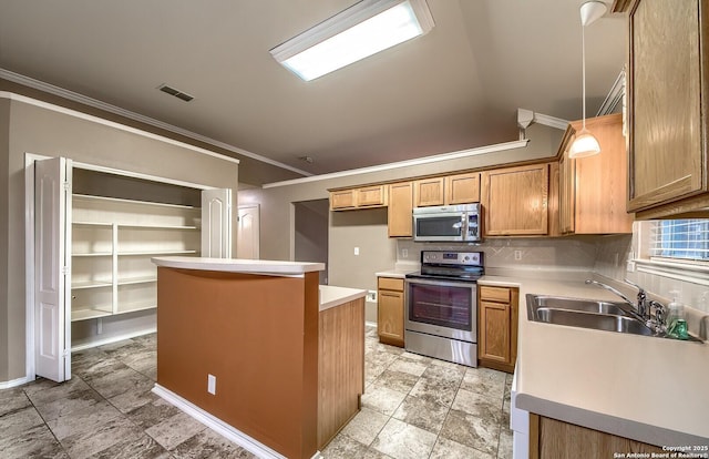 kitchen with sink, appliances with stainless steel finishes, decorative light fixtures, a kitchen island, and ornamental molding