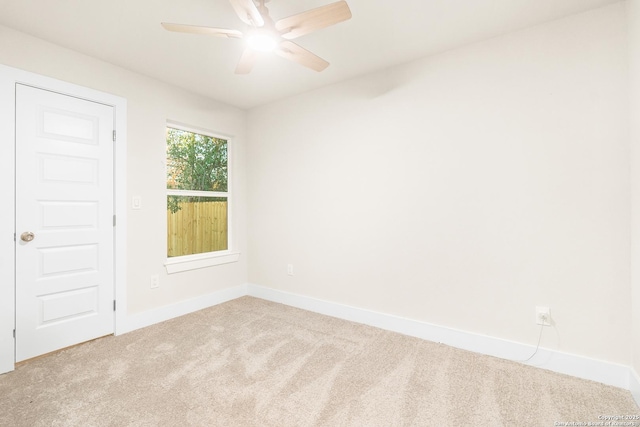 unfurnished room featuring ceiling fan and light colored carpet