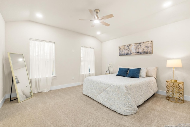 bedroom with carpet floors, vaulted ceiling, and ceiling fan