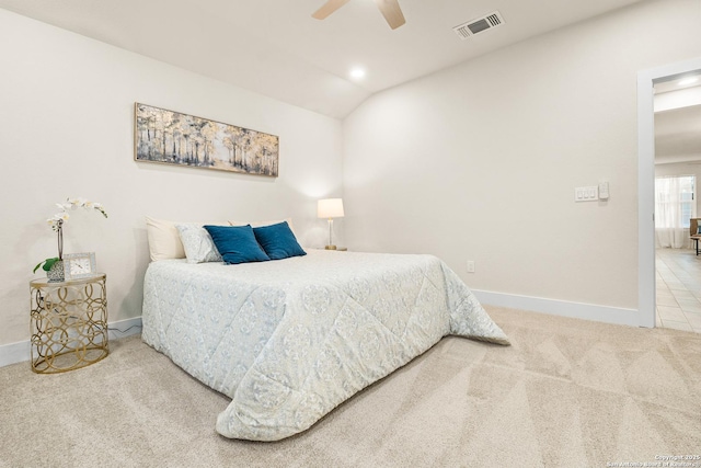 carpeted bedroom with ceiling fan and lofted ceiling