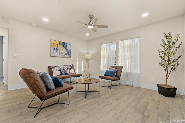 sitting room with ceiling fan