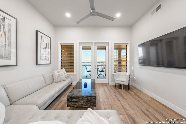 living room with french doors, hardwood / wood-style flooring, and ceiling fan