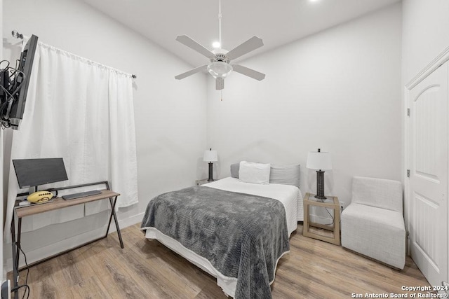 bedroom featuring ceiling fan and hardwood / wood-style floors