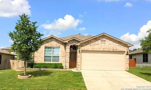 view of front of house with a garage and a front yard