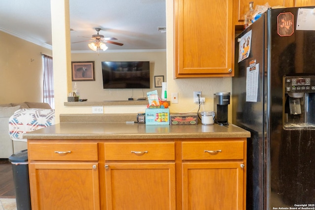 755 Eagles Gln, Schertz, TX 78108 - kitchen featuring black fridge, open floor plan, crown molding, a ceiling fan, and brown cabinets