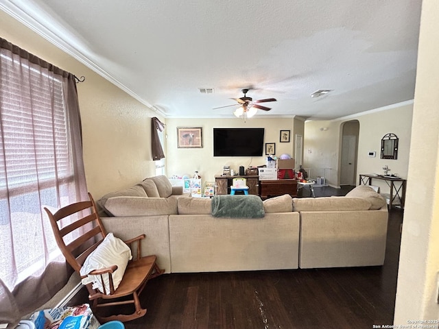 living room featuring crown molding, hardwood / wood-style floors, ceiling fan, and a textured ceiling