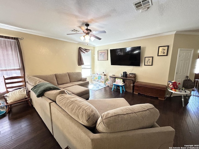 living room with a textured ceiling, ceiling fan, dark hardwood / wood-style flooring, and crown molding