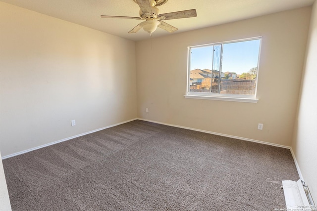 empty room featuring ceiling fan and carpet floors