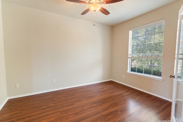 unfurnished room featuring ceiling fan and dark hardwood / wood-style flooring