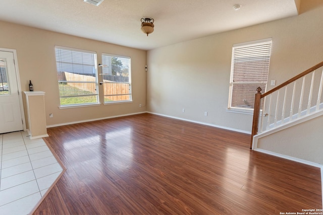 unfurnished living room featuring wood-type flooring