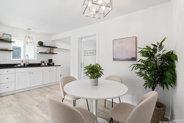 dining room featuring light hardwood / wood-style floors and sink