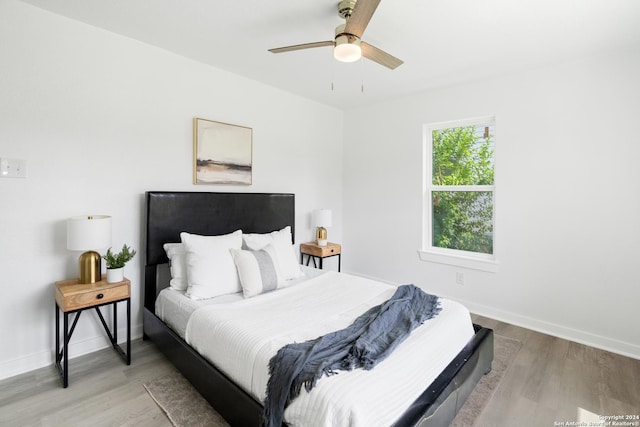 bedroom featuring hardwood / wood-style floors and ceiling fan