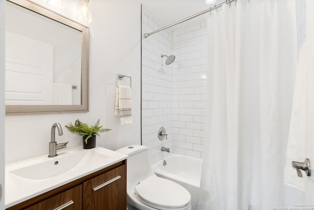 full bathroom featuring vanity, shower / bath combo, and toilet