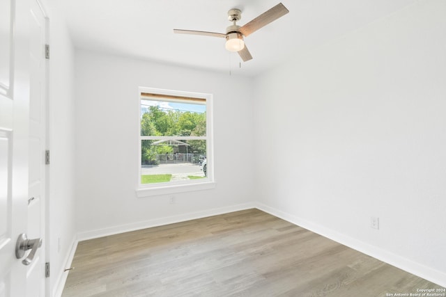 empty room featuring light wood-type flooring and ceiling fan