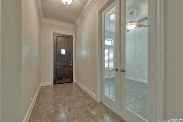 doorway with french doors, ceiling fan, and crown molding