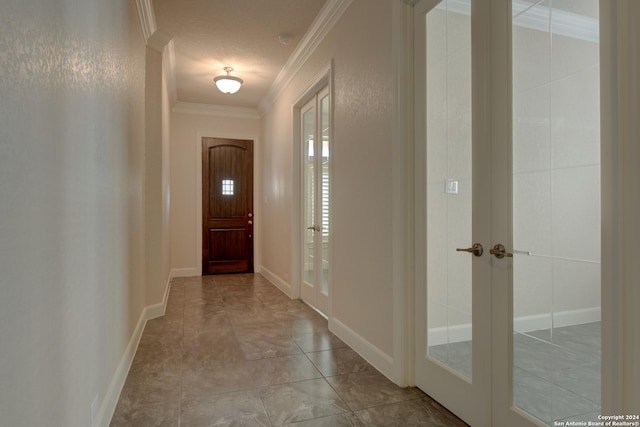 doorway to outside with crown molding and french doors