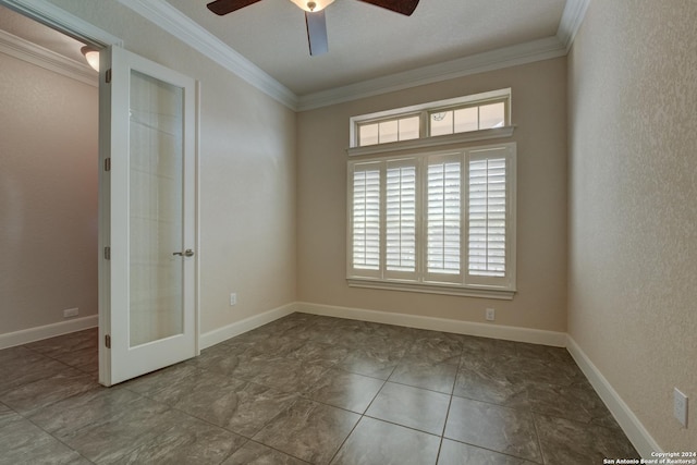 spare room with ceiling fan, crown molding, and french doors