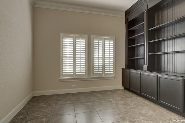 unfurnished room featuring crown molding