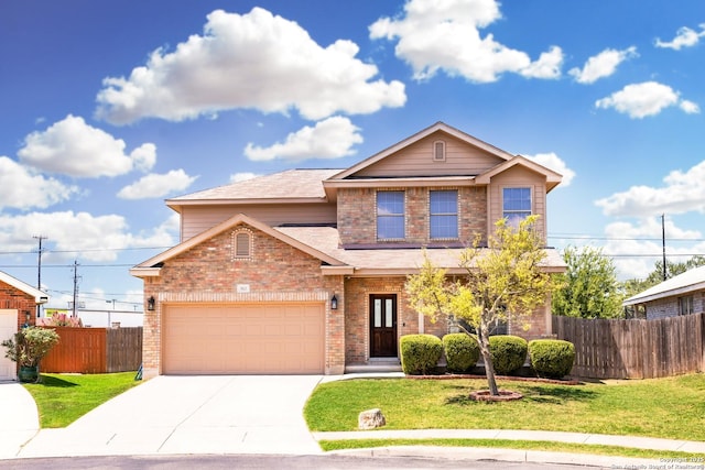 view of front of home featuring a front yard and a garage