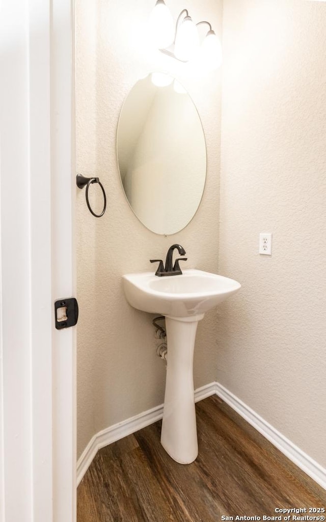 bathroom featuring wood-type flooring