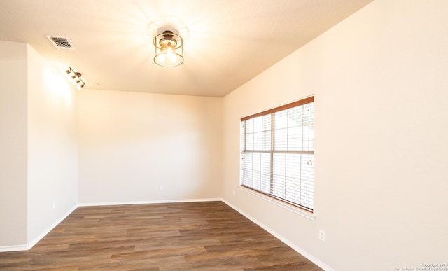 empty room with dark hardwood / wood-style floors