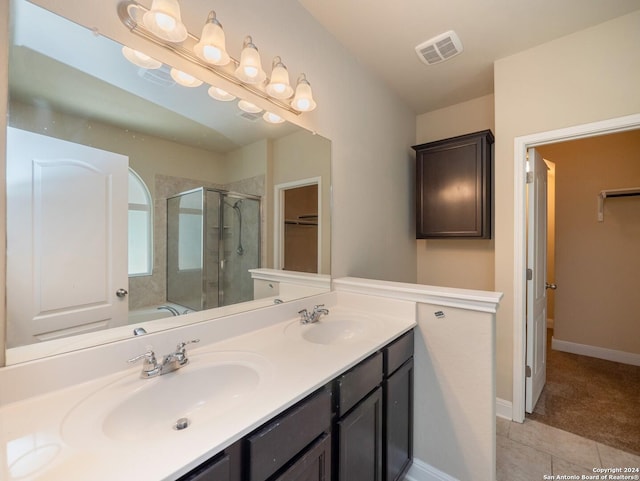 bathroom featuring tile patterned flooring, vanity, and independent shower and bath