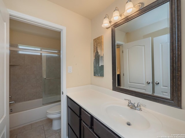 full bathroom with tile patterned flooring, vanity, toilet, and enclosed tub / shower combo